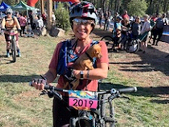 Wellness Ambassador Virginia Ellis and her puppy after a mountain bike race